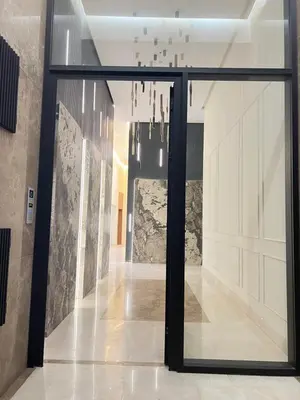 a hallway with a glass door and chandelier at Studio4 Comfortable rest in Casablanca