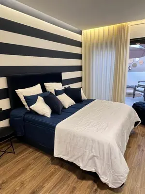 a bedroom with a blue bed with white sheets and pillows at Studio4 Comfortable rest in Casablanca