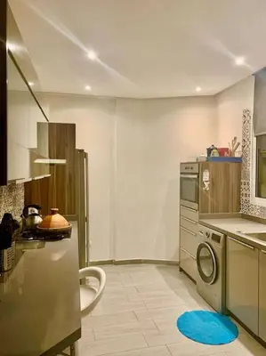 a kitchen with a washer and a washing machine at Appartementperle in Casablanca