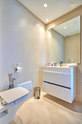 a bathroom with a sink and a toilet and a mirror at Ait Ali in Casablanca