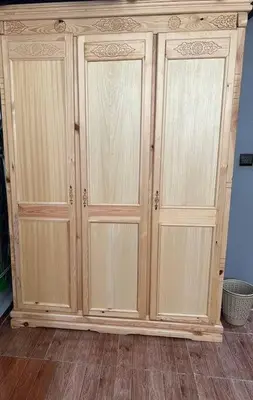 a wooden cabinet with two doors in a room at Elegant and Comfortable Apartment in the Heart of Rabat in Rabat
