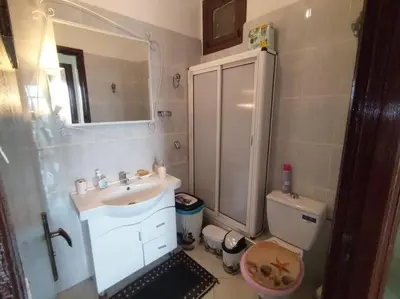 a small bathroom with a sink and a toilet at Paradis Avec Vue Harhoura in El Harhoura
