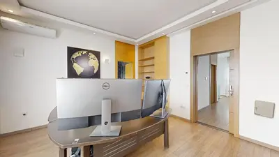an office with a desk with a computer on it at Villa 44- Superbe Villa Moderne 7 chambres, 2500m2, piscine, cinema, clim , meublee in Rabat