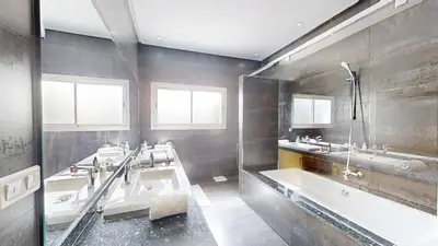 a bathroom with three sinks and two bath tubs at Villa 44- Superbe Villa Moderne 7 chambres, 2500m2, piscine, cinema, clim , meublee in Rabat