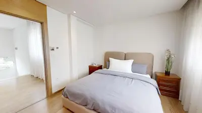 a bedroom with a large bed and a mirror at Villa 44- Superbe Villa Moderne 7 chambres, 2500m2, piscine, cinema, clim , meublee in Rabat