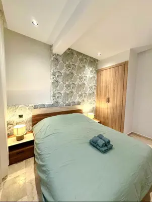 a bedroom with a bed with a towel on it at Casablanca Maarif Extension Green Retreat in Casablanca