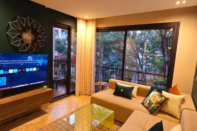 a living room with a couch and a flat screen tv at studio ghandi in Casablanca