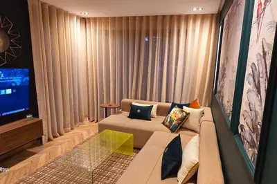 a living room with a couch and a tv at studio ghandi in Casablanca