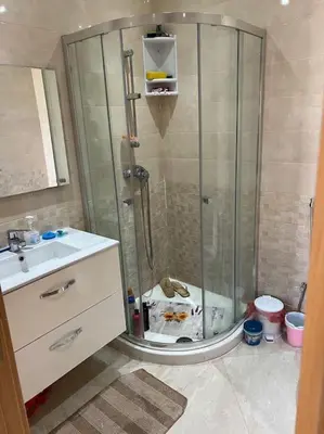 a bathroom with a shower and a sink at Logement paisible in Bouznika