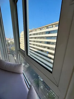 a view of a large building from a window at Loft art-déco centre-ville Casa in Casablanca
