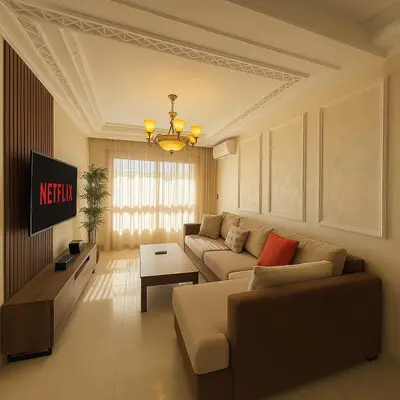 a living room with a couch and a table at Cosy ensoleillé 3 CH - central et proche du train et tramway in Casablanca
