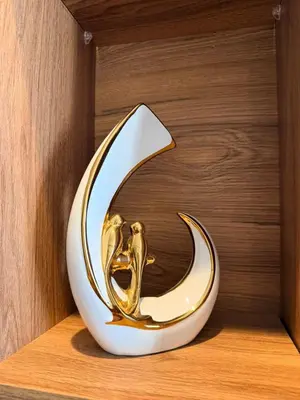 a gold fish bowl sitting on a wooden shelf at Studio Iris CFC in Casablanca