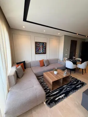 a living room with a couch and a table at Studio Iris CFC in Casablanca