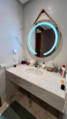 a bathroom with a sink and a mirror at N30 Élégance et Confort à La Corniche Rabat - Appartement de Luxe Essabah in Rabat