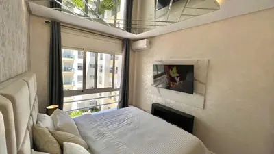 a small bedroom with a bed and a window at N30 Élégance et Confort à La Corniche Rabat - Appartement de Luxe Essabah in Rabat