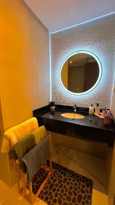 a bathroom with a sink and a mirror at N30 Élégance et Confort à La Corniche Rabat - Appartement de Luxe Essabah in Rabat