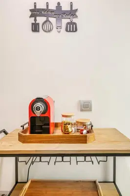 a table with a toaster and food on it at Sojori CFC fibre et parking in Casablanca
