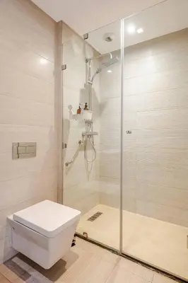 a bathroom with a shower and a toilet at Sojori CFC fibre et parking in Casablanca