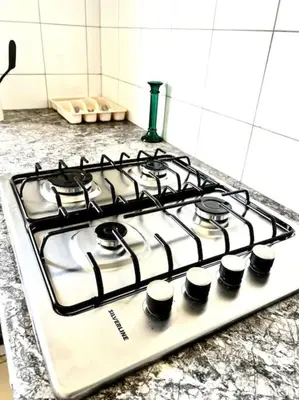 a stove top oven sitting on top of a kitchen counter at Appartement en résidence privée in Casablanca