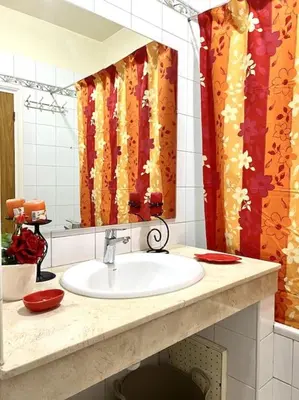 a bathroom with a sink and a mirror at Appartement en résidence privée in Casablanca