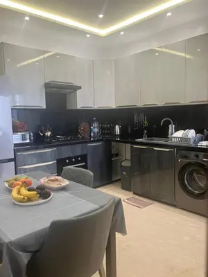 a kitchen with a table with a plate of food on it at Moroccan Beach Delight in Dar Bouazza