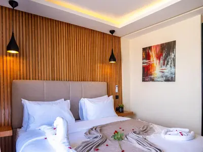 a bedroom with a bed with towels on it at Unico Hotel Maarif in Casablanca