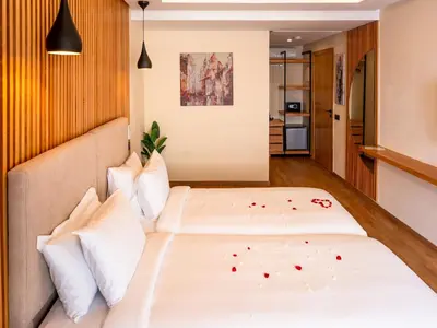 a bedroom with two beds in a room at Unico Hotel Maarif in Casablanca