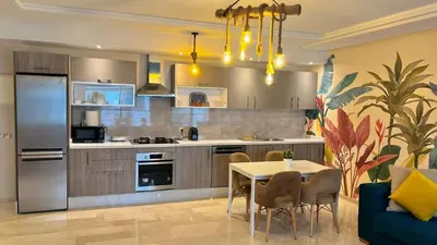 a kitchen with a table and a dining room at D22 Appartement haut standing au Maarif, confort in Casablanca