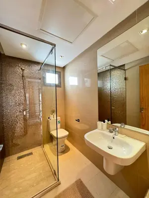 a bathroom with a sink and a shower and a toilet at Street view 2BR Terrace - AppartAli Luxury Platform in Casablanca