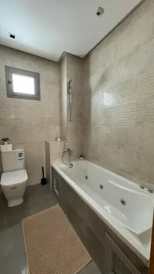 a bathroom with a bath tub and a toilet at Dreamy 3BR with Terrace -AppartAli Luxury Platform in Casablanca