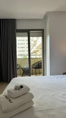 a bedroom with a bed with two towels on it at Dreamy 3BR with Terrace -AppartAli Luxury Platform in Casablanca