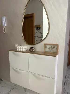 a mirror on top of a dresser in a bathroom at Cosy appartement lumineux Awards 2026 in Bouznika