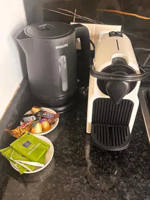 a coffee maker sitting on top of a counter at Cosy appartement lumineux Awards 2026 in Bouznika