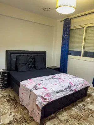a bedroom with a bed with a quilt on it at Appartement 5 min à gare Bouskoura & Hôpital Mohamed 6 in Bouskoura