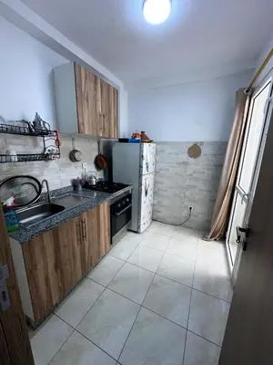 a small kitchen with a sink and a stove at Appartement 5 min à gare Bouskoura & Hôpital Mohamed 6 in Bouskoura