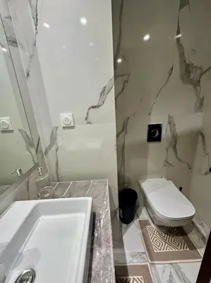 a bathroom with a white sink and a toilet at Studio Jasmin CFC n 15 in Casablanca