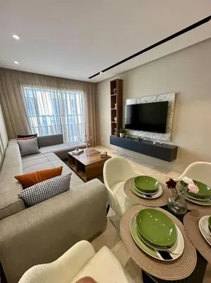 a living room with a couch and a table at Studio Jasmin CFC n 15 in Casablanca