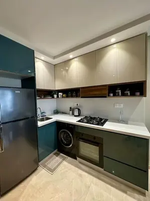a kitchen with a refrigerator and a stove top oven at Studio Jasmin CFC n 15 in Casablanca