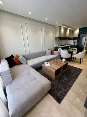 a living room with a couch and a table at Studio lotus CFC n 21 in Casablanca