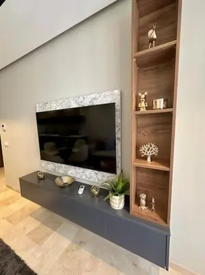 a living room with a flat screen tv on a wall at Studio lotus CFC n 21 in Casablanca