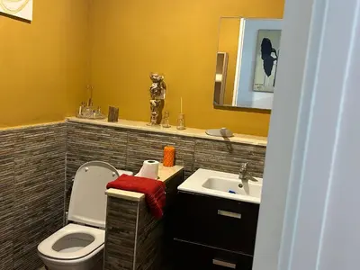 a bathroom with a toilet and a sink at Magnifique appartement maarif in Casablanca