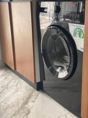 a washing machine sitting inside of a room at Bel appartement de plage - RDC - Dahomey Beach in Bouznika