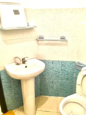 a bathroom with a sink and a toilet at Mohammed V Airport Appartement in Deroua