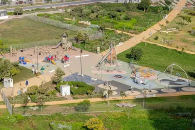 an aerial view of a park with a playground at Studio Élégant avec piscine à Zenata Eco city in Aïn Harrouda