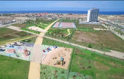 an aerial view of a park with a playground at Studio Élégant avec piscine à Zenata Eco city in Aïn Harrouda