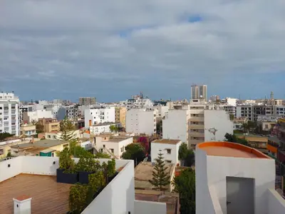 a view of a city with white buildings at Welcome Home Palmiers in Casablanca