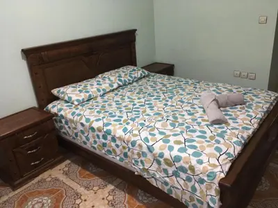 a bedroom with a bed with a stuffed animal on it at Appartement à louer UNIQUEMENT pour famille et couple marié in Mohammedia