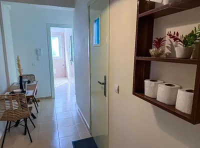 a hallway with a door and a table and a dining room at très joli appartement vue sur mer présentation acte de mariage si couple in Rabat