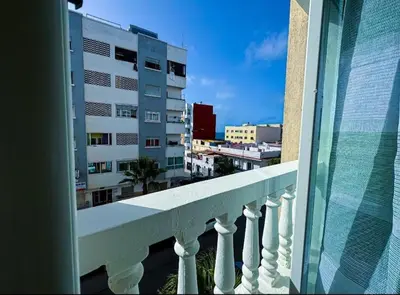 a balcony with a view of a building at très joli appartement vue sur mer présentation acte de mariage si couple in Rabat