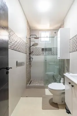 a bathroom with a shower and a toilet at L Évasion ZEN Duplex d Exception Entre Plage et Serenite in Mohammedia